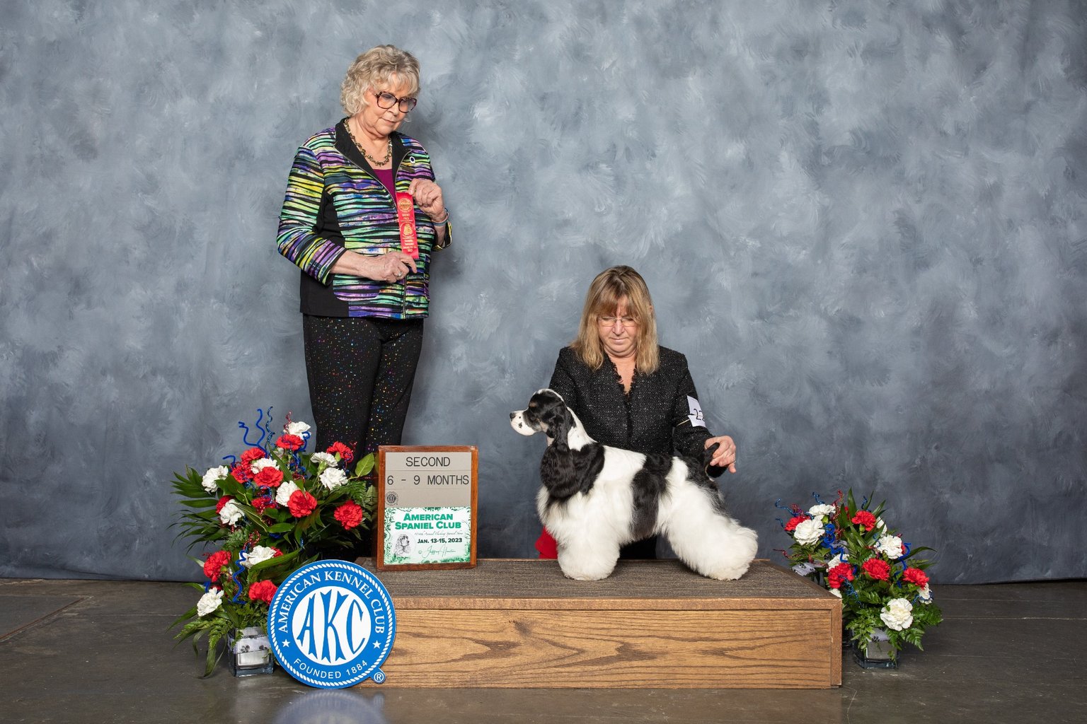 Family with cocker spaniel